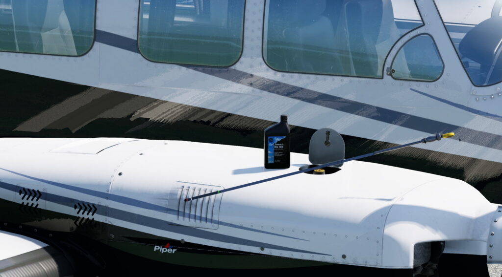 Gros plan du fuselage et de l'aile du Piper Chieftain avec remplissage d'huile et jauge visibles sur le dessus du capot moteur droit