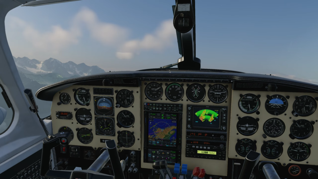 Cockpit du CIS Piper Chieftain en vol au-dessus de l'Alaska, montrant le tableau de bord et l'avionique de l'avion